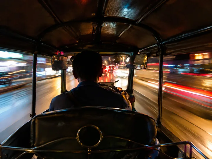 The view from inside a tuk-tuk at night