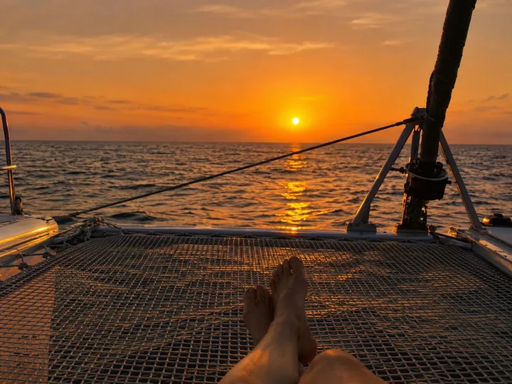 The net deck of a catamaran at sunset