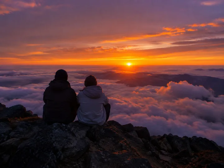 Sunset above a sea of clouds from a mountain top
