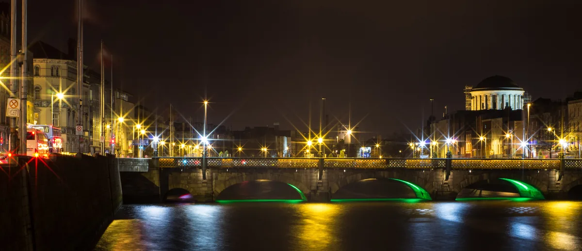Lit bridges and quays along the River Liffey in Dublin at night