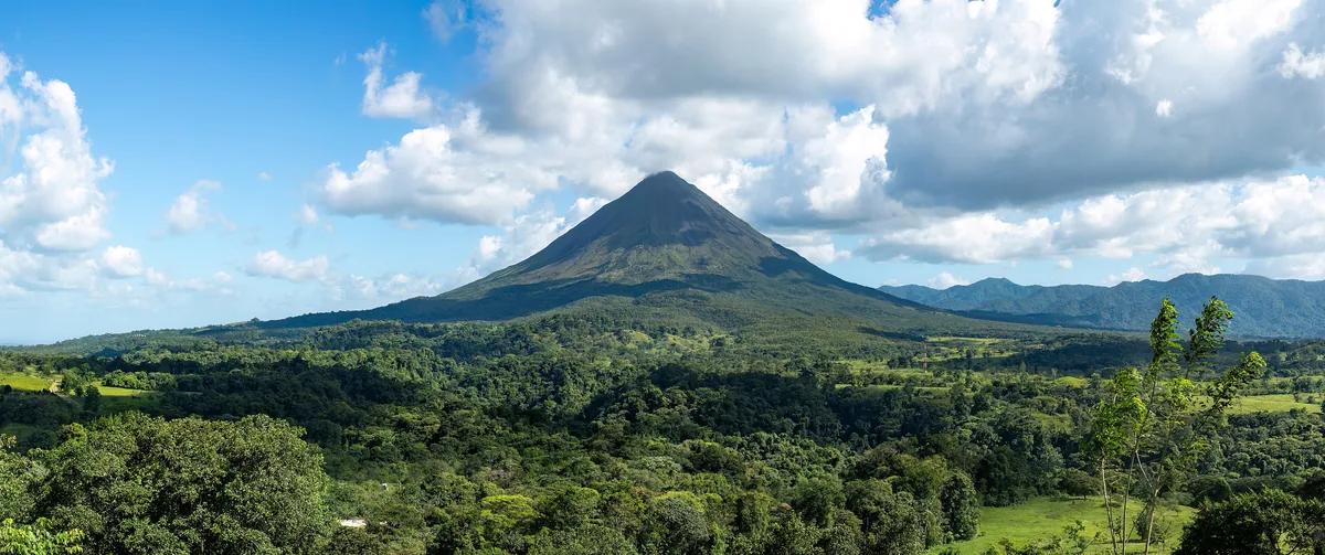 Arenal Volcano above the rainforest near La Fortuna, Costa Rica, by day