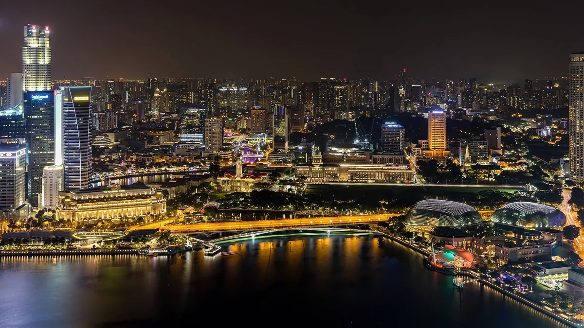 Singapore's Marina Bay and the business district towers lit at night