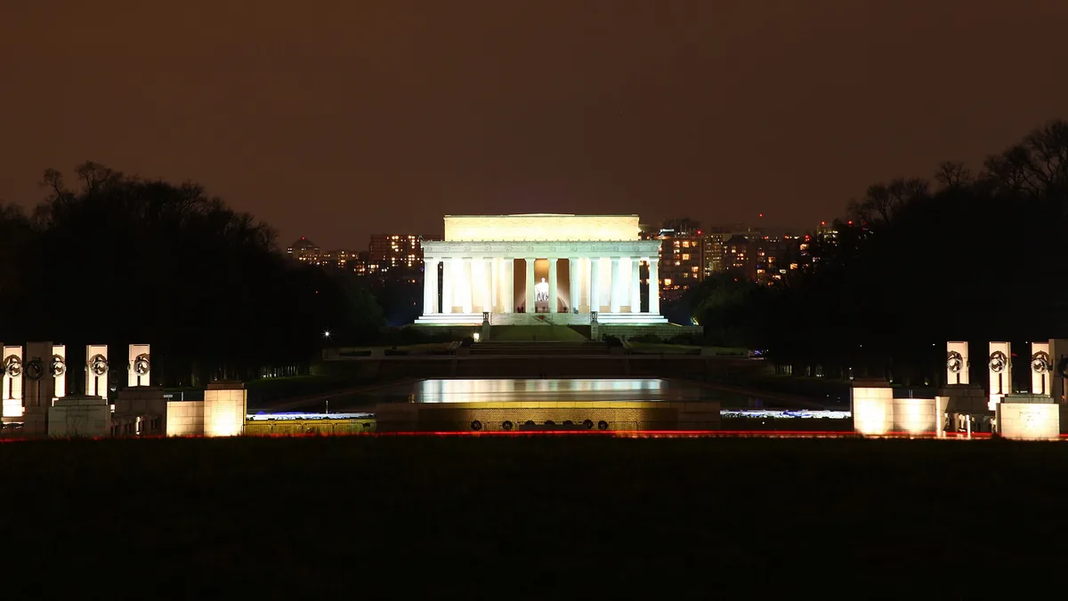 The Lincoln Memorial lit at night at the end of the National Mall
