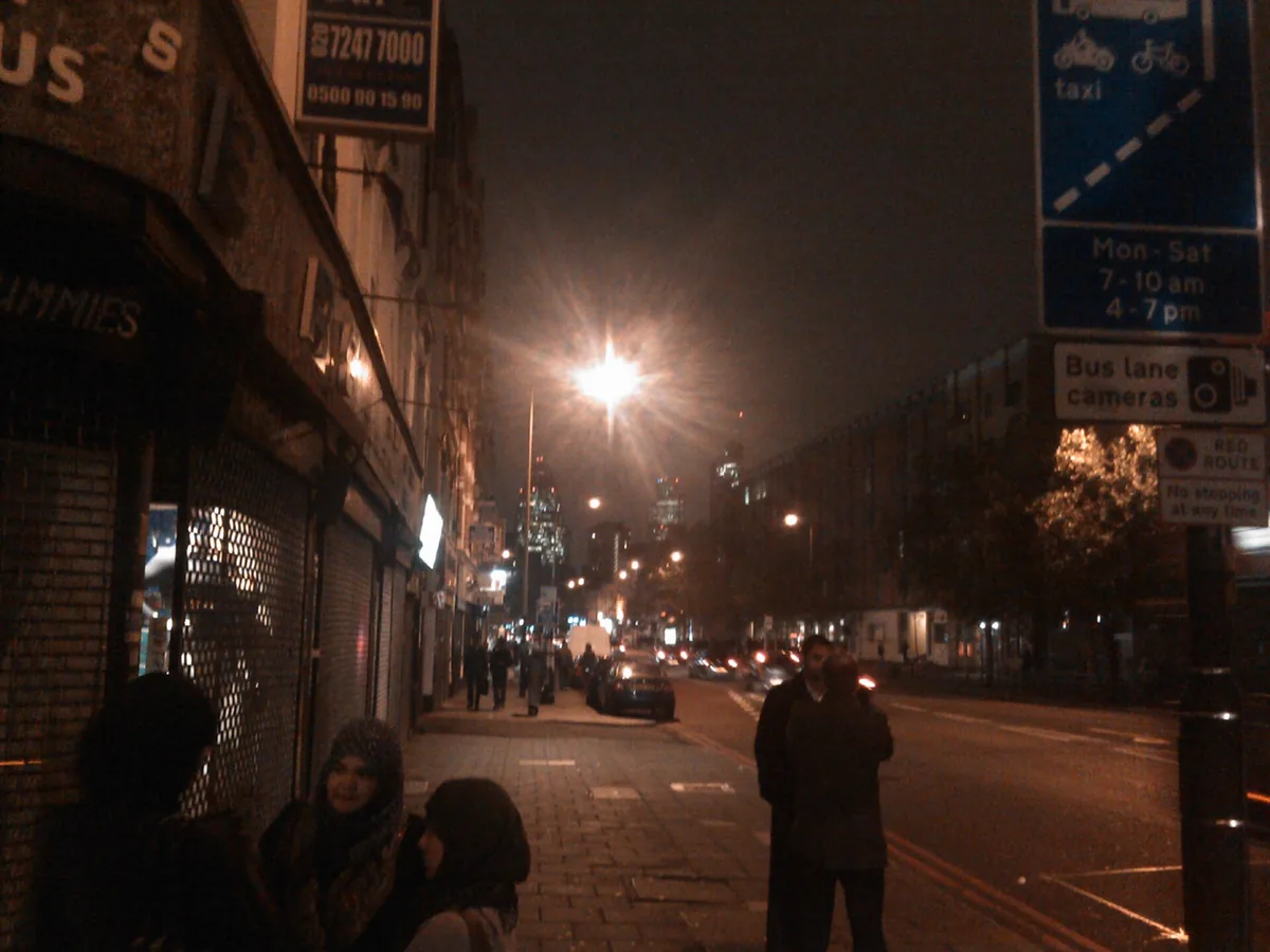 A street of shuttered shops at night near Liverpool Street in East London