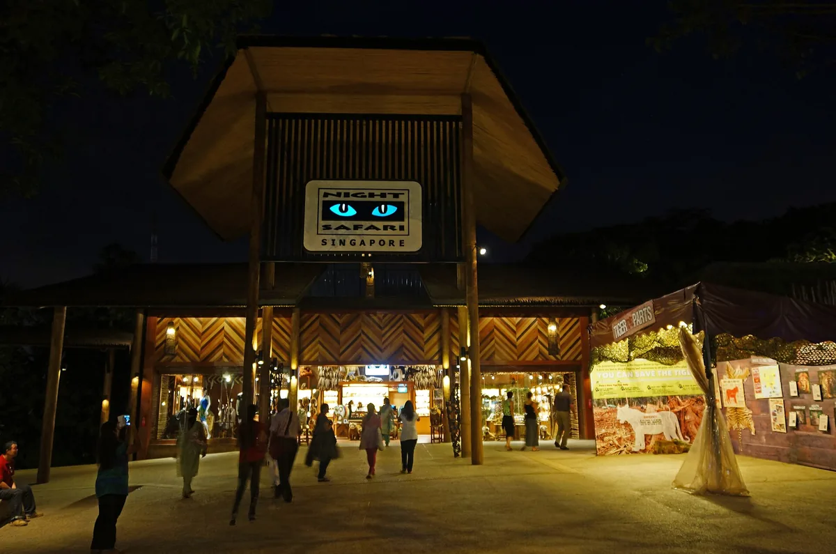 The lit entrance pavilion of the Night Safari in Singapore after dark